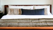 70" X 50" Black Brown And Ivory Faux Fur Leopard Plush Throw Blanket
