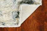 9' X 13' Ivory And Blue Abstract Area Rug