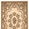 5' X 8' Beige And Brown Floral Medallion Area Rug