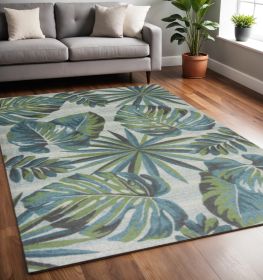5' X 8' Beige Teal And Green Tropical Botanical Area Rug
