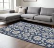 7' X 9' Blue And Ivory Floral Medallion Area Rug