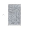 5' X 7' Slate Blue And Ivory Abstract Shag Hand Woven Area Rug