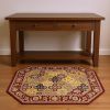 7' Red Orange And Black Quatrefoil Octagon Rug
