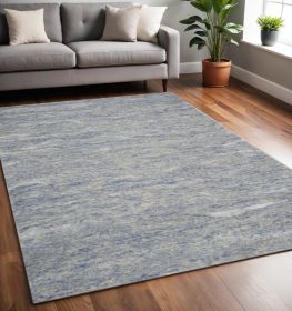5' X 7' Blue And Beige Abstract Hand Tufted Area Rug