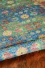 2' X 4' Blue Red And Beige Floral Medallion Hand Woven Distressed Area Rug