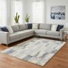 7' X 9' Ivory and Blue Area Rug