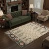 5' X 8' Ivory Green And Red Southwestern Area Rug