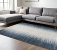 8' X 11' Ivory And Blue Abstract Area Rug