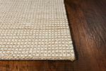 5' X 7' Tan And Ivory Hand Woven Area Rug