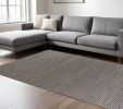 7' X 10' Blue And Beige Abstract Hand Woven Area Rug