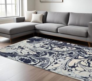 7' X 10' Blue And Ivory Abstract Area Rug