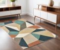 4' X 6' Blue Green And Beige Abstract Geometric Area Rug