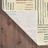 7' X 10' Ivory Blue And Red Geometric Area Rug