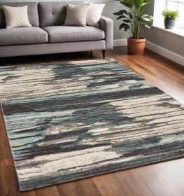 5' X 7' Ivory Blue And Gray Abstract Area Rug
