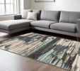 6' X 9' Ivory Blue And Gray Abstract Area Rug
