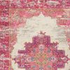 5' X 7' Ivory And Fuchsia Oriental Distressed Area Rug