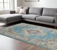 7' X 10' Blue And Ivory Medallion Distressed Area Rug