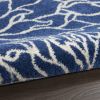 5' X 7' Blue And Ivory Floral Area Rug