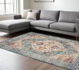7' X 10' Ivory And Blue Oriental Distressed Area Rug
