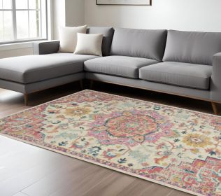 7' X 10' Pink And Ivory Southwestern Distressed Area Rug