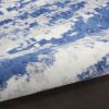5' X 7' Ivory And Blue Ombre Distressed Area Rug