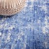 6' X 9' Blue And Ivory Abstract Distressed Area Rug