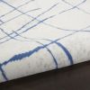 5' X 7' Ivory And Blue Geometric Distressed Area Rug