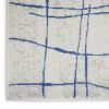 5' X 7' Ivory And Blue Geometric Distressed Area Rug