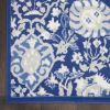 6' X 9' Blue And Ivory Floral Area Rug