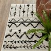 5' X 7' Ivory And Black Abstract Geometric Distressed Area Rug