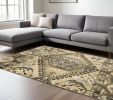 8' X 11' Tan And Gold Medallion Area Rug