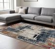 7' X 9' Blue And Ivory Abstract Area Rug