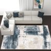 6' X 9' Blue And Ivory Abstract Dhurrie Area Rug